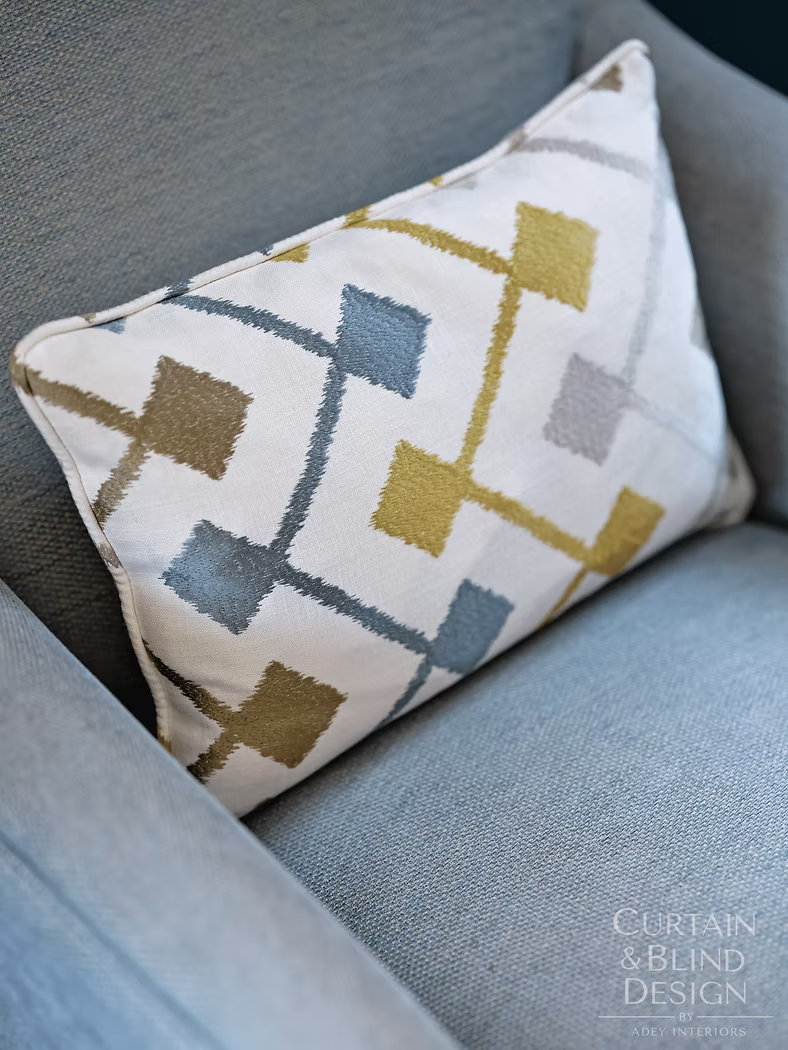 Bespoke geometric scatter cushion made for a blue upholstered chair
