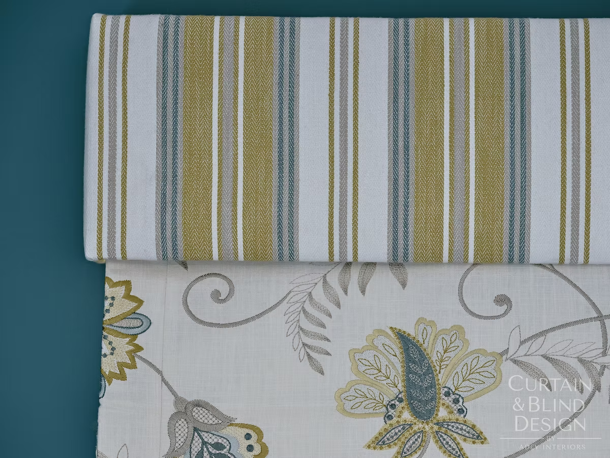 Striped and floral blind fabrics compared side by side during an in-home fabric selection